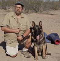 Hans with a dog, from the seminar archive.